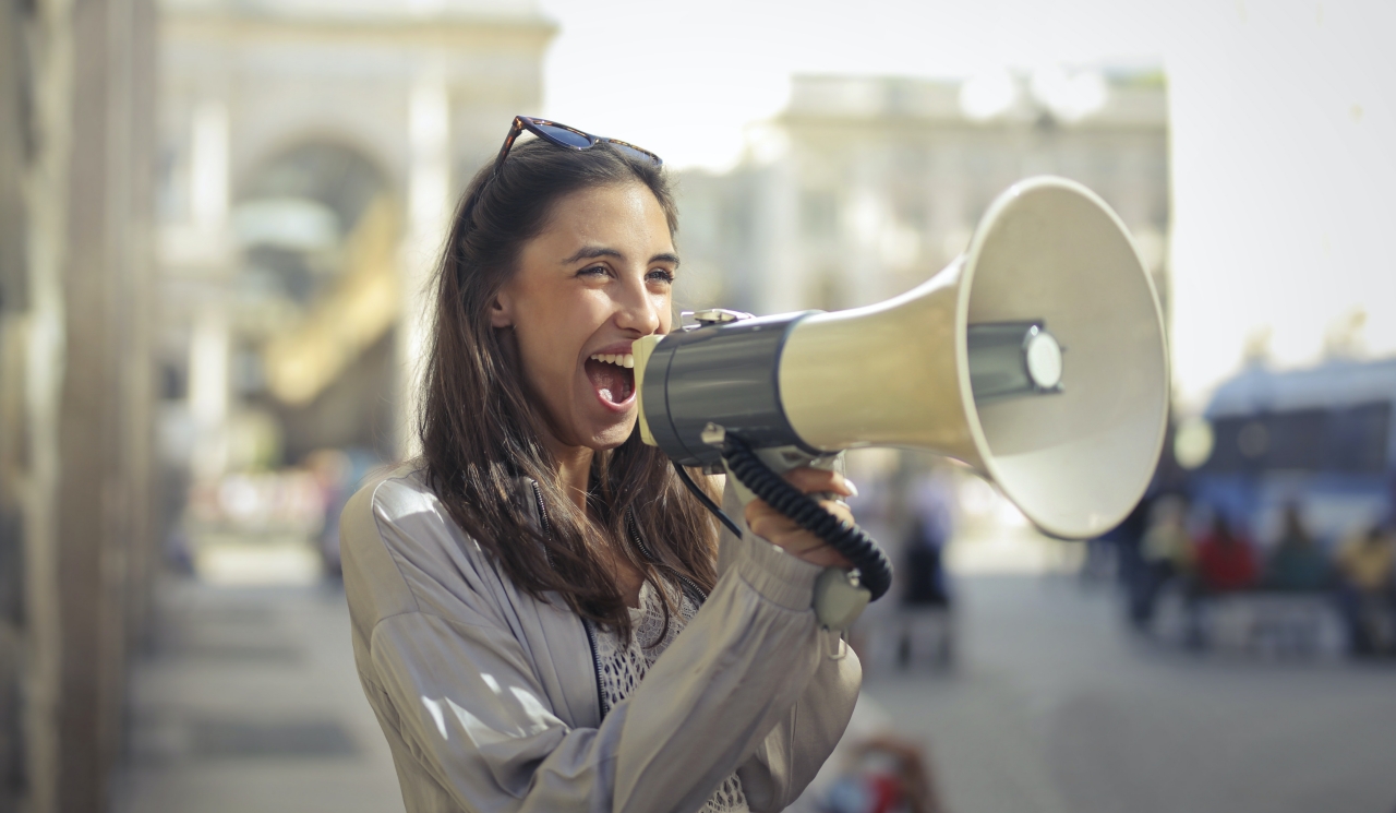Image of woman using a megaphone, metaphor for a call for papers