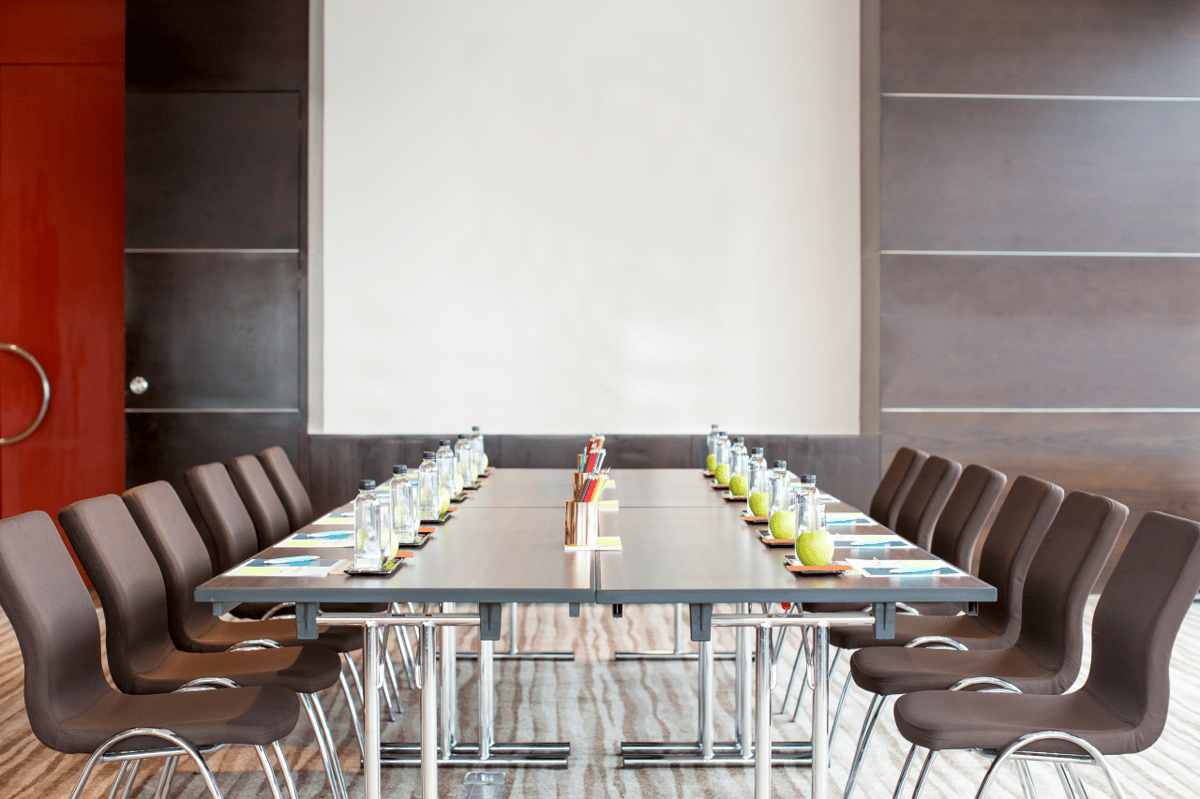 Who sits on a conference organising committee?